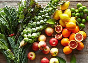 a group of fruits and vegetables on a wood surface Healthy Weight Loss Diets Port Glasgow